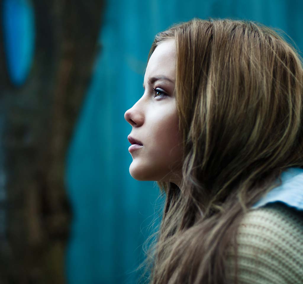 Young girl reflecting.